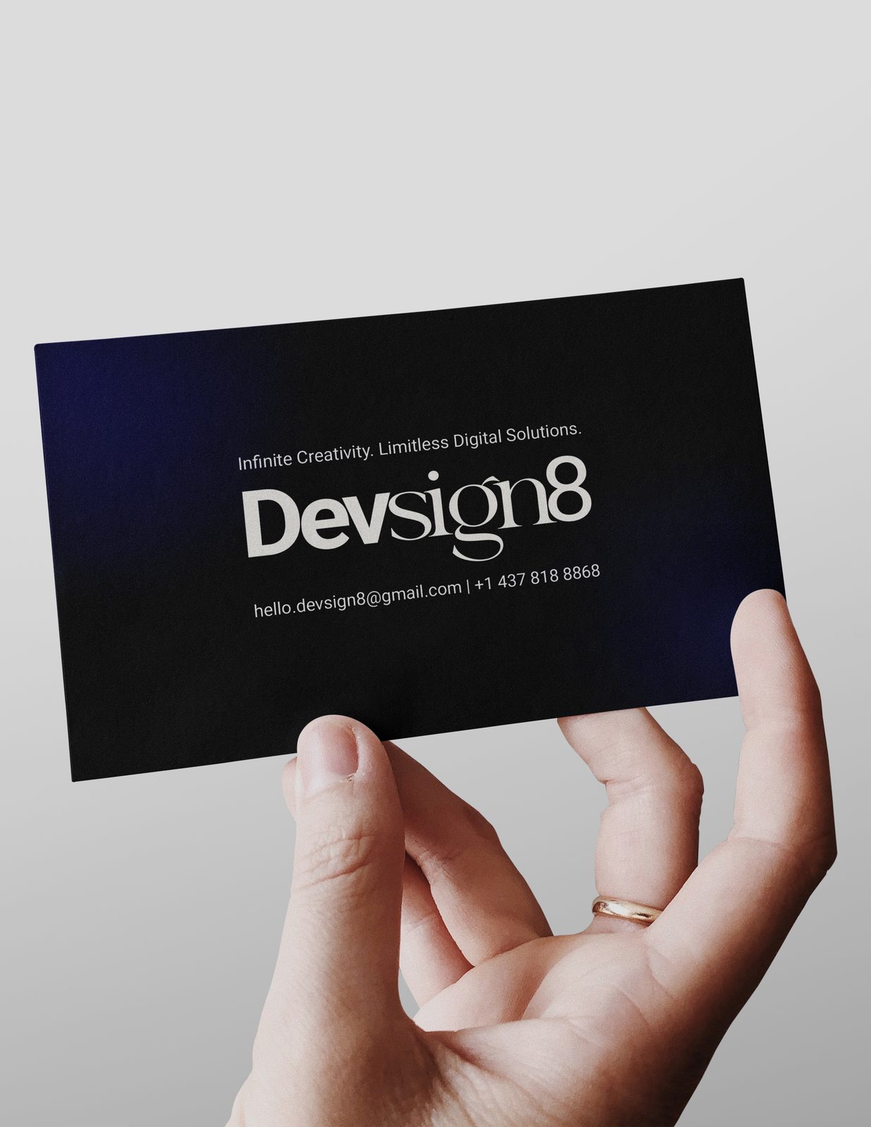 Devsign8 business card held in hand
