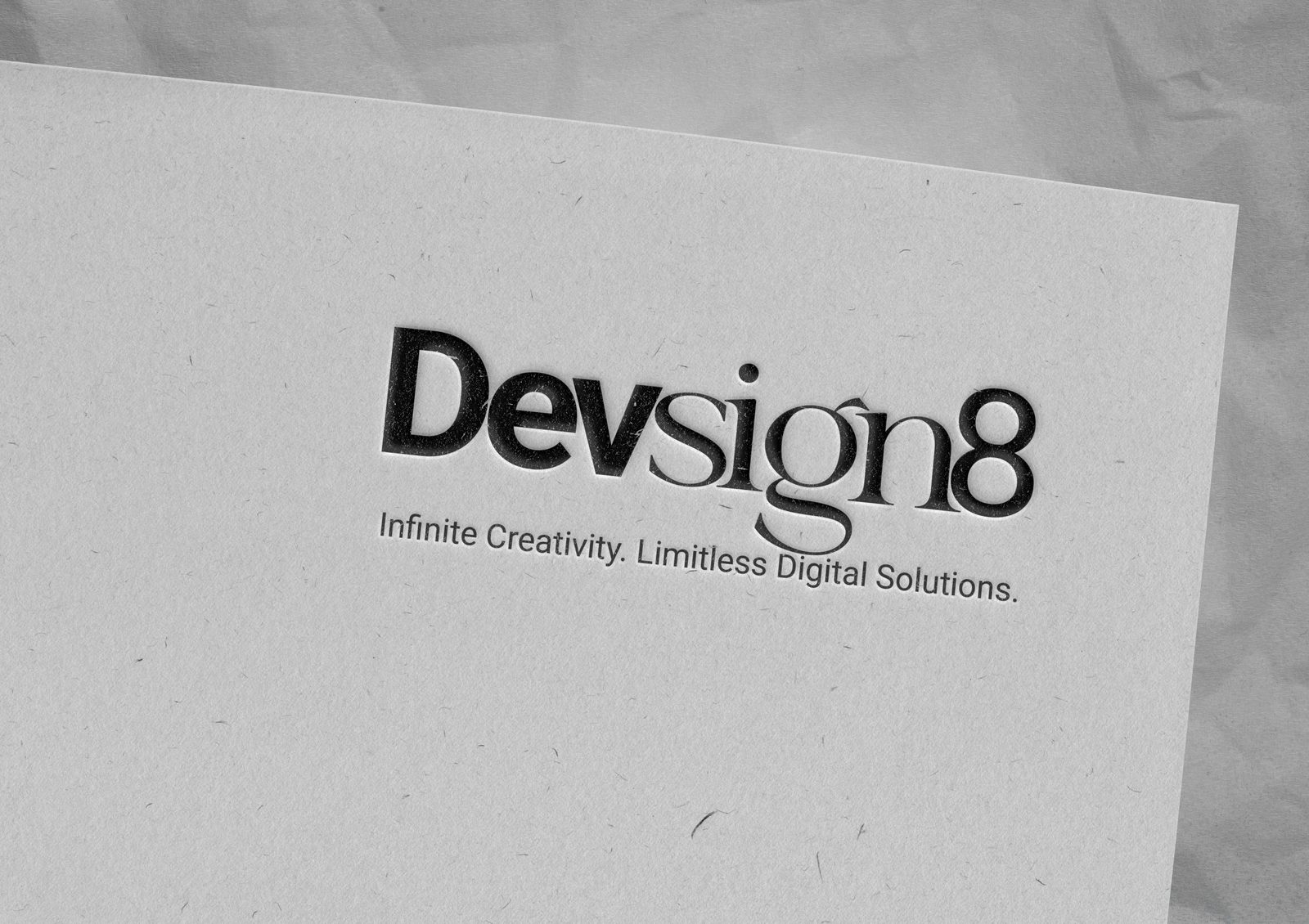 Devsign8 wordmark letterpressed into paper stationery